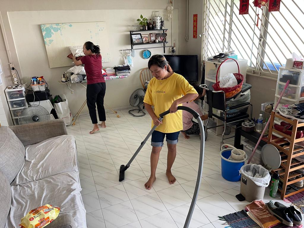 Indonesian Maid learning to vacuum